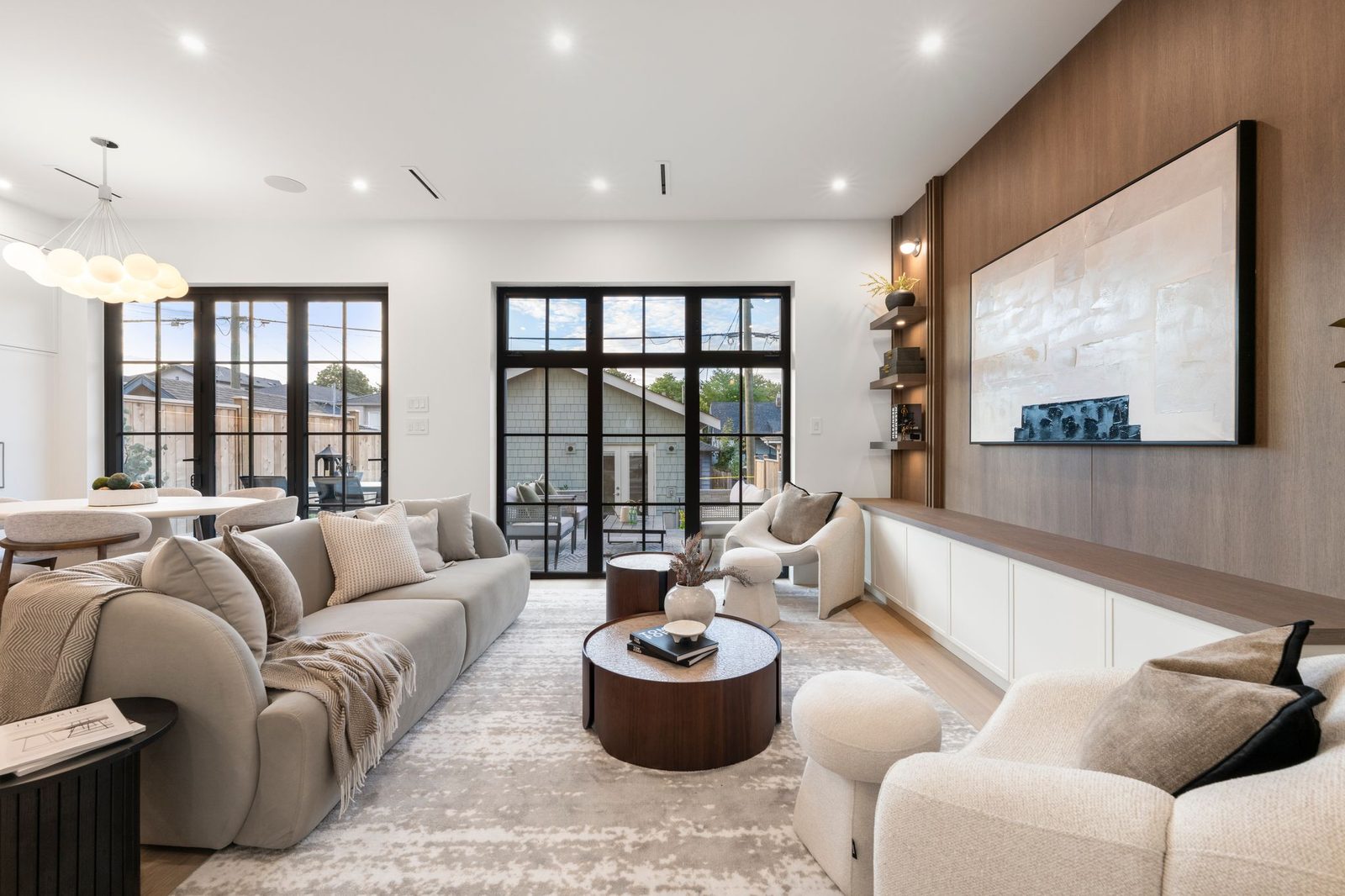 The Eton — living room with glass doors to the yard